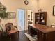 Ornate office with hardwood floors, decorative desk, and cozy seating area at 5114 Hawkstone Dr, Sanford, FL 32771