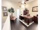 Elegant home office space with high ceilings, wood floors, stylish desk, and neutral decor, perfect for productivity at 5114 Hawkstone Dr, Sanford, FL 32771