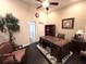 Office space boasts a large wooden desk, ceiling fan, a bookshelf, and attractive furnishings at 5114 Hawkstone Dr, Sanford, FL 32771