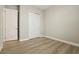 Bedroom with wood floors, closet and door to adjoining room at 5254 Citrus Leaf Blvd, Winter Garden, FL 34787