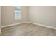 This well lit bedroom contains vinyl wood flooring and a bright window at 5254 Citrus Leaf Blvd, Winter Garden, FL 34787