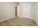 An unfurnished bedroom with walk in closet and hard wood flooring at 5254 Citrus Leaf Blvd, Winter Garden, FL 34787
