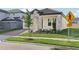 Charming single-story home features a stone facade, tile roof and manicured lawn at 5254 Citrus Leaf Blvd, Winter Garden, FL 34787