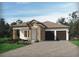Charming single-story home features a stone facade, tile roof and a two-car garage at 5254 Citrus Leaf Blvd, Winter Garden, FL 34787
