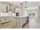 A bright kitchen boasts stainless steel appliances, a center island, and hardwood floors at 5254 Citrus Leaf Blvd, Winter Garden, FL 34787
