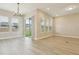 Bright living room features hardwood floors, recessed lights, and sliding glass doors at 5254 Citrus Leaf Blvd, Winter Garden, FL 34787