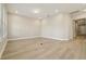 Bright living room features hardwood floors, recessed lights, and lots of natural light at 5254 Citrus Leaf Blvd, Winter Garden, FL 34787