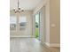 Bright living room features hardwood floors, recessed lights, and sliding glass doors at 5254 Citrus Leaf Blvd, Winter Garden, FL 34787