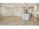 Open-concept kitchen and living room area features hardwood floors and natural light at 5254 Citrus Leaf Blvd, Winter Garden, FL 34787
