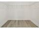 Empty walk-in closet featuring light wood flooring and white wire shelving at 5254 Citrus Leaf Blvd, Winter Garden, FL 34787