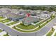 Aerial view of a home with a fenced yard, green lawn, and landscaping in a residential neighborhood at 5393 Red Coral Cir, Mount Dora, FL 32757
