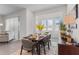 Cozy dining area filled with natural light, featuring modern furnishings and stylish decor at 5393 Red Coral Cir, Mount Dora, FL 32757