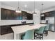 Bright kitchen with sleek stainless steel appliances, ample counter space, and stylish pendant lighting at 5393 Red Coral Cir, Mount Dora, FL 32757