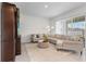 Comfortable living room with neutral tones, a plush rug, and a stylish floor lamp at 5393 Red Coral Cir, Mount Dora, FL 32757