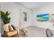 Inviting living room with stylish furniture, natural light, and a mounted TV for relaxed entertainment at 5393 Red Coral Cir, Mount Dora, FL 32757
