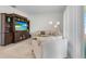 Inviting living room featuring a built-in entertainment center and neutral decor at 5393 Red Coral Cir, Mount Dora, FL 32757