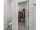 Walk-in closet adjacent to the bathroom for extra storage space at 5393 Red Coral Cir, Mount Dora, FL 32757