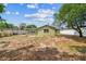 Backyard featuring the rear of the house, and a white privacy fence at 6042 Bolling Dr, Orlando, FL 32808