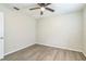 Bedroom with ceiling fan and wood-look flooring at 6042 Bolling Dr, Orlando, FL 32808
