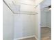 View of a closet featuring wood-look flooring and a metal shelving unit at 6042 Bolling Dr, Orlando, FL 32808