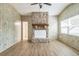 Bright living room featuring a stone fireplace and wood-look flooring at 6042 Bolling Dr, Orlando, FL 32808