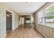 Bright living room featuring a stone fireplace and wood-look flooring at 6042 Bolling Dr, Orlando, FL 32808