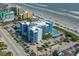 Aerial view of the condo with beach access, swimming pool, and ample parking at 611 S Atlantic Ave # 4212, New Smyrna Beach, FL 32169