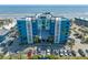 Exterior view of a beautifully maintained condo building with ample parking and stunning beach front access at 611 S Atlantic Ave # 4212, New Smyrna Beach, FL 32169