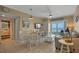 Inviting living room with dining area, comfortable seating and balcony access with ocean view at 611 S Atlantic Ave # 4212, New Smyrna Beach, FL 32169
