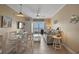 Cozy living room with beach view, tile flooring, dining area and comfortable seating arrangement at 611 S Atlantic Ave # 4212, New Smyrna Beach, FL 32169