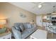 Cozy living room with a comfortable sofa, side tables, and an open layout to the kitchen at 611 S Atlantic Ave # 4212, New Smyrna Beach, FL 32169