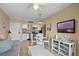 Open-concept living area with a fully equipped kitchen, sofa, TV, and a dining space at 611 S Atlantic Ave # 4212, New Smyrna Beach, FL 32169