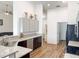 Bright kitchen featuring stainless steel appliances, granite countertops, and wood-look vinyl plank flooring at 6730 Orlando Drive, Indian Lake Estates, FL 33855