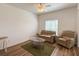 This living room features a comfortable seating area with wood-look floors at 6730 Orlando Drive, Indian Lake Estates, FL 33855