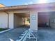 A view of the entrance to the Pro Shop, with a paved driveway and signage at 6730 Orlando Drive, Indian Lake Estates, FL 33855