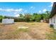 The property boasts a spacious backyard and includes an additional storage shed at 6820 Ambassador Dr, Orlando, FL 32818