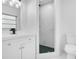 Bright bathroom featuring a walk-in shower with marble tiling, and vanity with modern fixtures at 6820 Ambassador Dr, Orlando, FL 32818