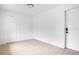 Bright bedroom featuring wood floors, two white doors and a modern locking system at 6820 Ambassador Dr, Orlando, FL 32818