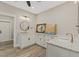 Bathroom vanity includes double sinks with granite counters and contemporary fixtures at 72 Fairway Cir, Umatilla, FL 32784
