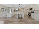 Spacious kitchen features white cabinets, stainless steel appliances, and a central island at 72 Fairway Cir, Umatilla, FL 32784