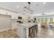 The home features a kitchen with an open floor plan to the living room area at 72 Fairway Cir, Umatilla, FL 32784