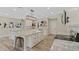 Modern kitchen features white cabinets, granite countertops, and a stylish island at 72 Fairway Cir, Umatilla, FL 32784