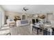 Spacious living area featuring modern furnishings, hardwood floors, and seamless open-concept design at 72 Fairway Cir, Umatilla, FL 32784