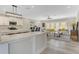 Open-concept living area featuring a modern kitchen, comfortable seating, and lots of space at 72 Fairway Cir, Umatilla, FL 32784