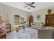 Stylish living room featuring lots of natural light, ceiling fan, and neutral colors at 72 Fairway Cir, Umatilla, FL 32784
