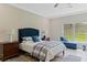 Comfortable main bedroom features large window and accent pillows at 72 Fairway Cir, Umatilla, FL 32784