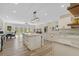 Open floor plan features the kitchen, dining area and living room, great for entertaining at 72 Fairway Cir, Umatilla, FL 32784