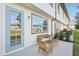 Cozy back patio with ample seating and view of exterior at 734 Longboat Dr, Davenport, FL 33896