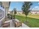 Inviting back patio with ample seating and lush lawn at 734 Longboat Dr, Davenport, FL 33896