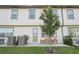 Spacious backyard with lush lawn, cozy seating area, and exterior of home at 734 Longboat Dr, Davenport, FL 33896
